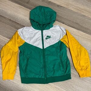 Well loved Nike Big Kids Green, Yellow, and White windbreaker jacket